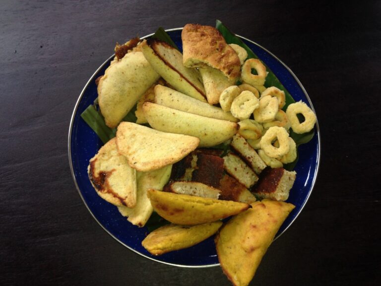 Plate of traditional Costa Rican corn pastries, empanadas and rosquillas on a cultural tour
