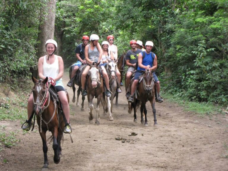 Guests in helmets on a horseback ride along a forest trail at Rincón de la Vieja, Guanacaste, Costa Rica