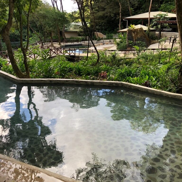 Natural hot spring pool surrounded by forest at Rincón de la Vieja, Guanacaste, Costa Rica