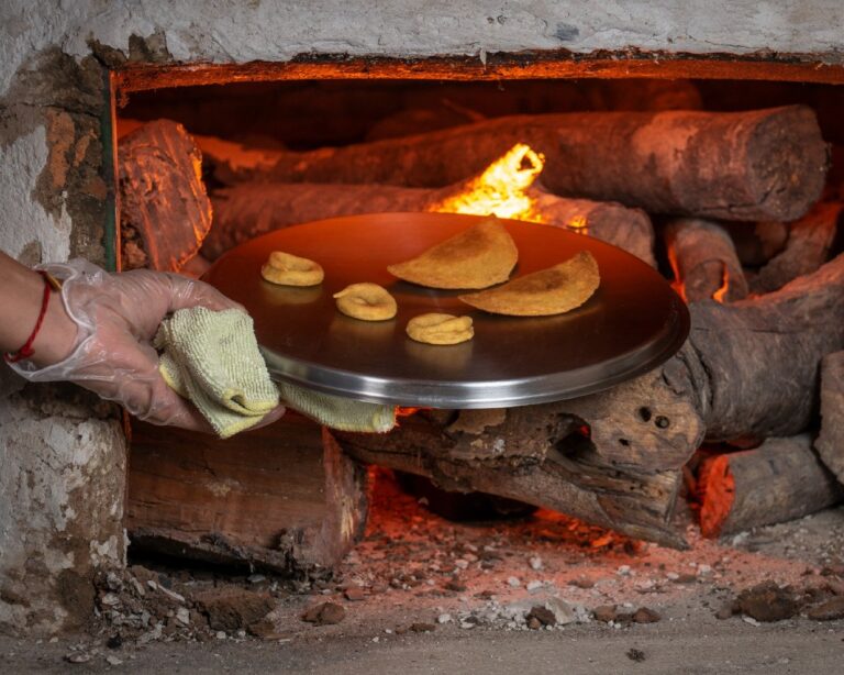 Traditional corn rosquillas and empanadas baked in a wood-fired oven on a Costa Rican cultural tour