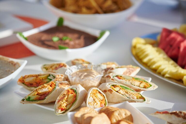 Lunch on board the catamaran with chicken wraps, bean dip, chips and fresh pineapple and watermelon