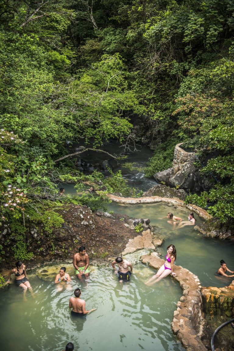 Stone-edged hot spring pools stepping down to the Río Negro in the forest, Rincón de la Vieja, Costa Rica