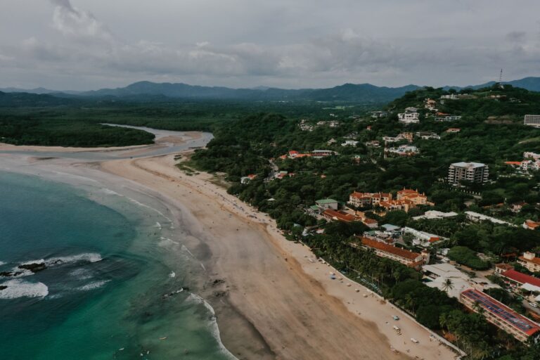 Aerial view of Tamarindo Beach, the town and the estuary in Guanacaste, Costa Rica