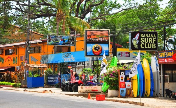 Surf shops and surfboards for rent on the main street of Tamarindo