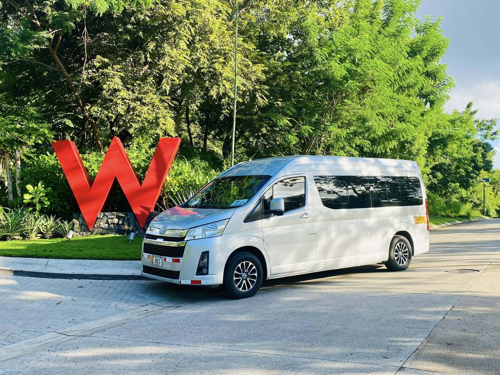 Blue Sky Toyota Hiace van on a private transfer at the entrance of W Costa Rica, Reserva Conchal